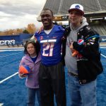 Residents hugging BSU Football player